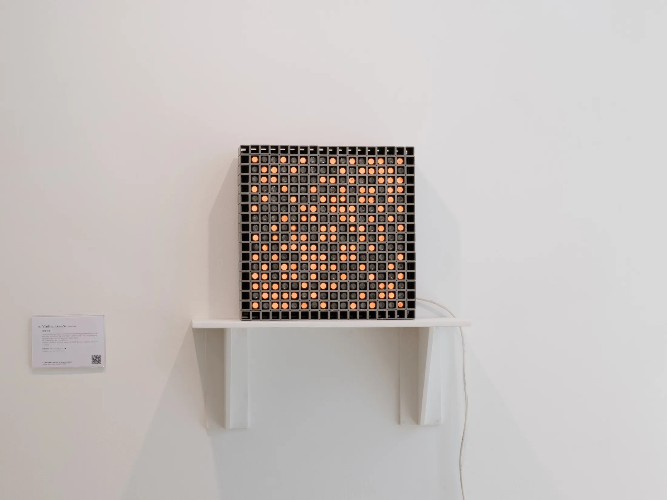 Illuminated light-grid work on a wall shelf, Ex-Machina installation view, Phillips, 2022