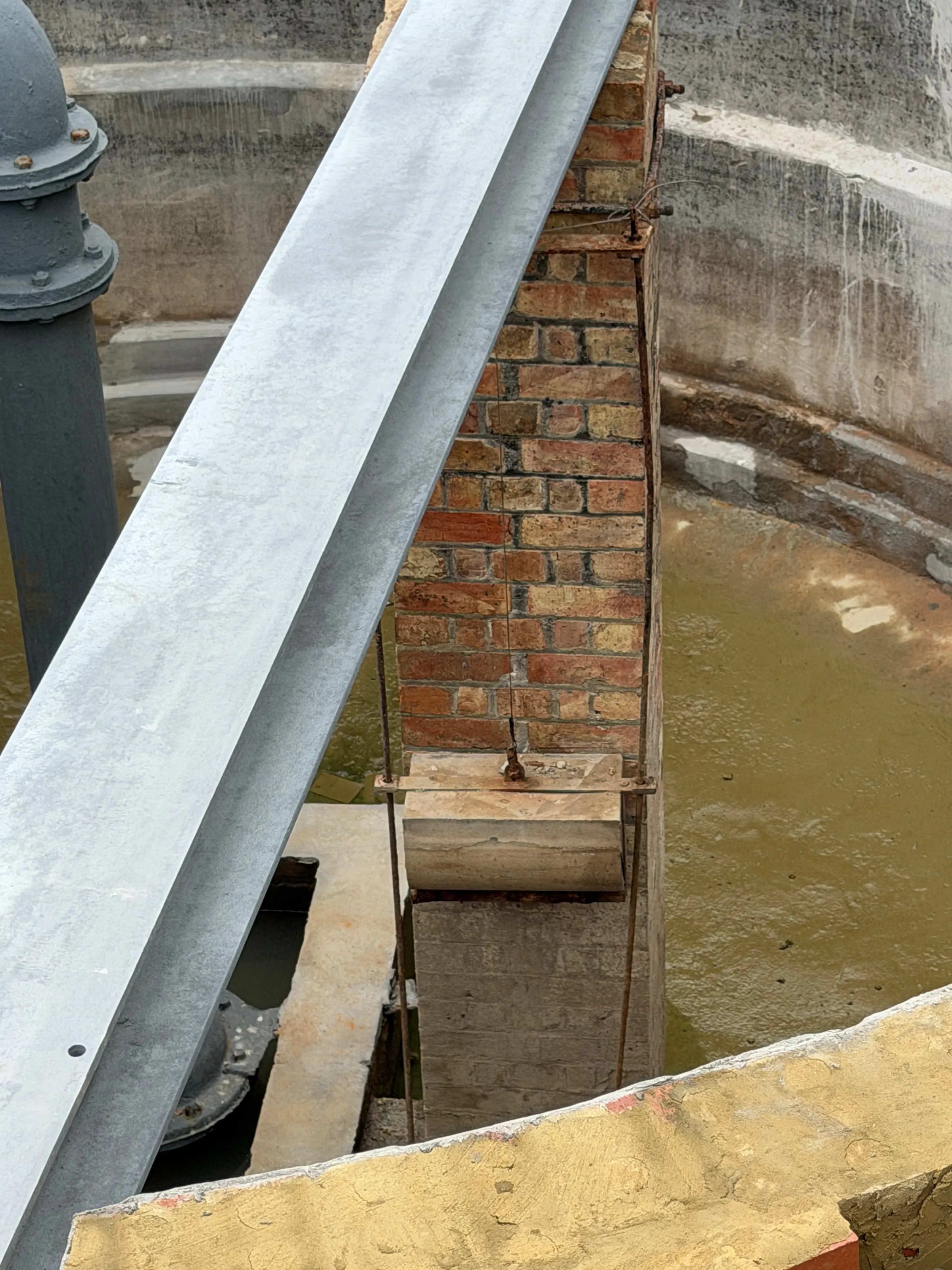 Restored brick pier and steel girder above the counterweight water tank in the Leas Lift engine house